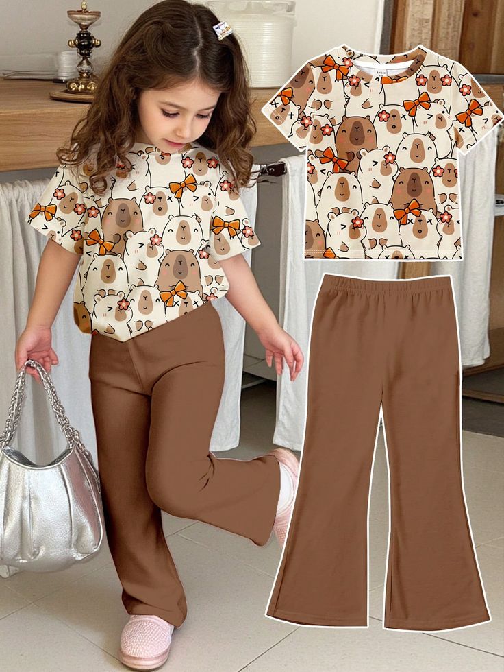 all-over cartoon print of bears and small orange bows. & brown pant