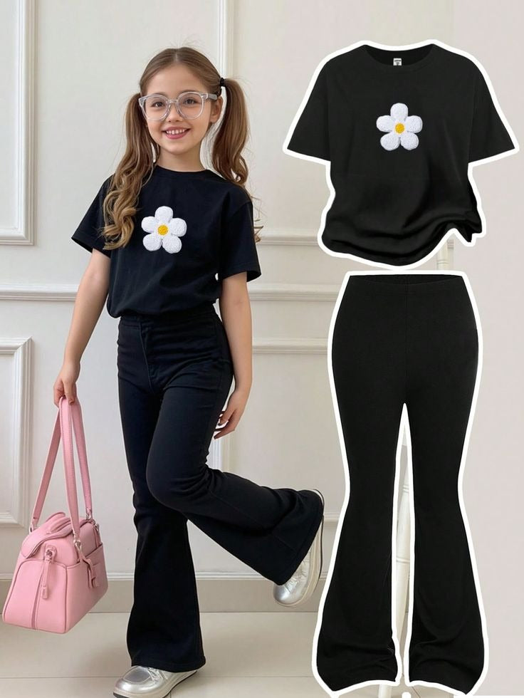 The set is black and features a cute white daisy print on the t-shirt.