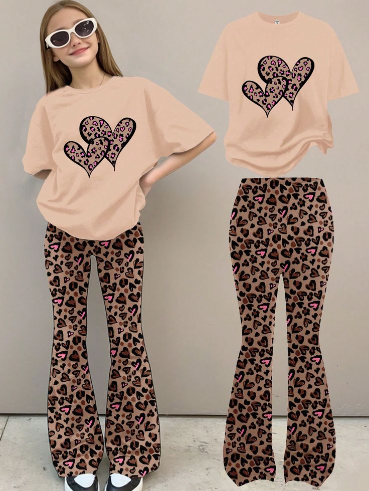 T-shirt in a light beige or peach color with a graphic of multiple leopard-print hearts