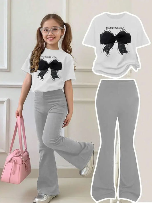 Summer fashion goals with this black bow print t-shirt and grey pants combo.